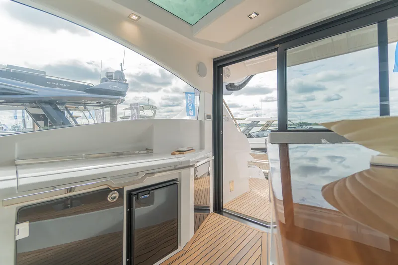 Lady C Yacht Photos Pics 2022 Galeon 485 HTS yacht interior with modern design and wooden flooring.