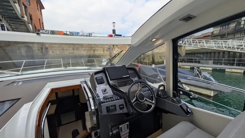 Lady C Yacht Photos Pics 2022 Galeon 485 HTS yacht cockpit with modern steering and navigation controls.