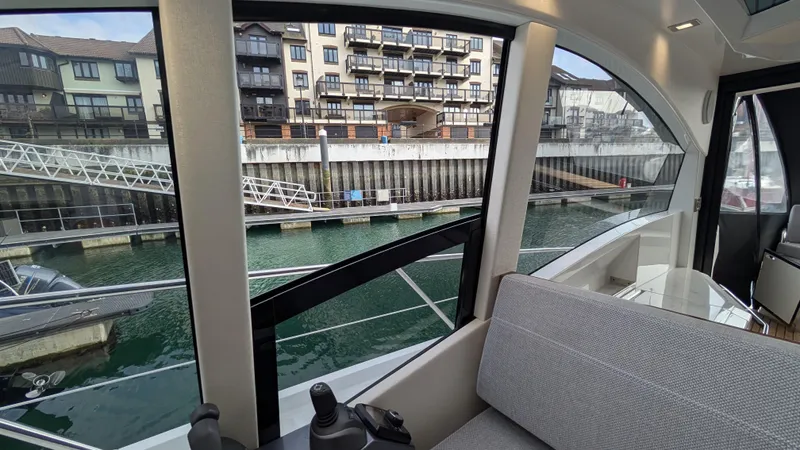 Lady C Yacht Photos Pics Interior view of 2022 Galeon 485 HTS yacht docked at a marina.