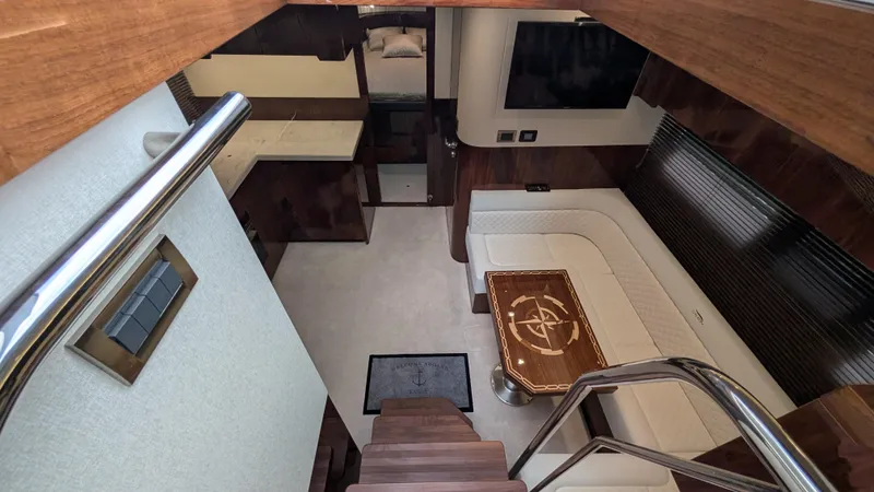 Lady C Yacht Photos Pics Luxurious interior of 2022 Galeon 485 HTS yacht with elegant seating and wooden accents.