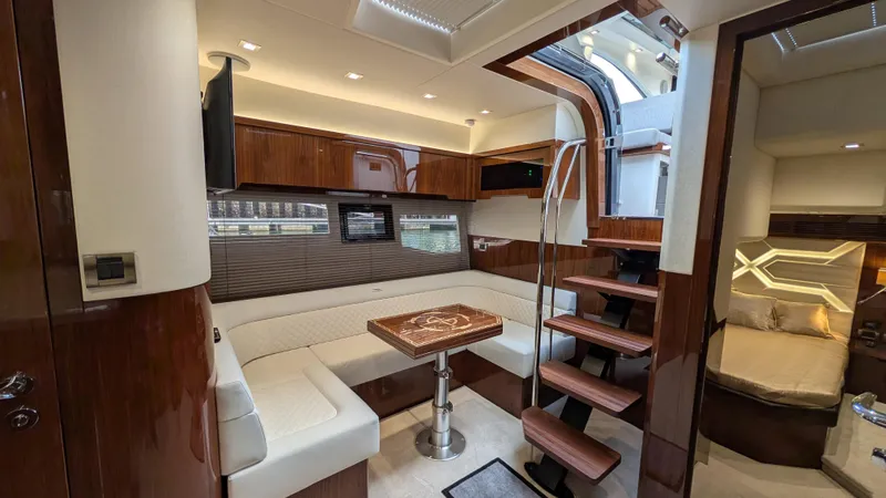 Lady C Yacht Photos Pics Luxurious interior of 2022 Galeon 485 HTS yacht with elegant seating and wooden accents.