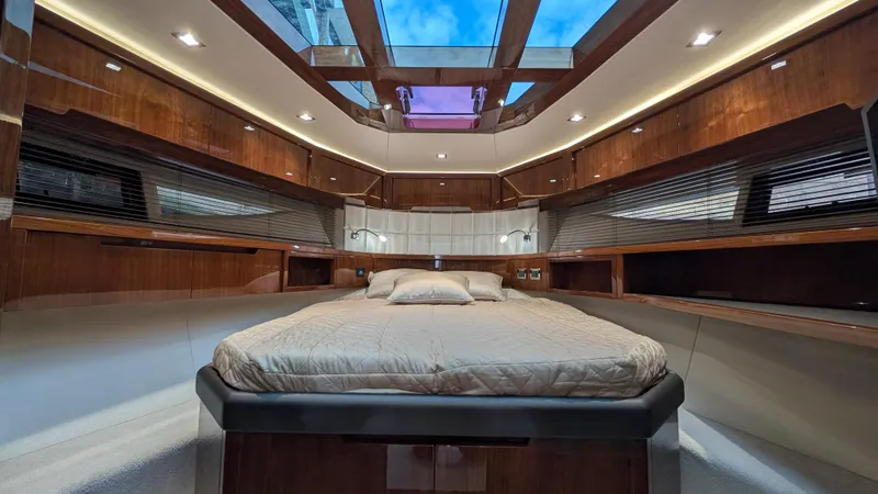 Lady C Yacht Photos Pics Luxurious interior of 2022 Galeon 485 HTS yacht with elegant wood finishes and skylight.