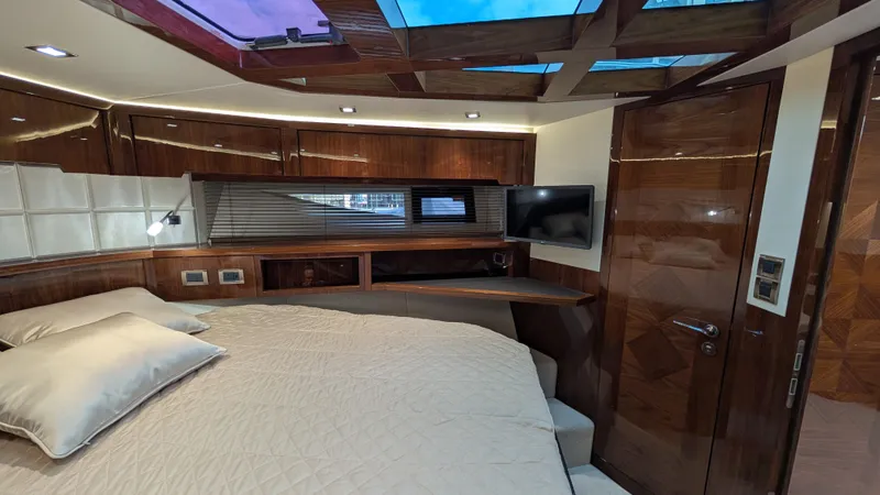 Lady C Yacht Photos Pics Luxurious interior of 2022 Galeon 485 HTS yacht with modern wood finishes and skylight.