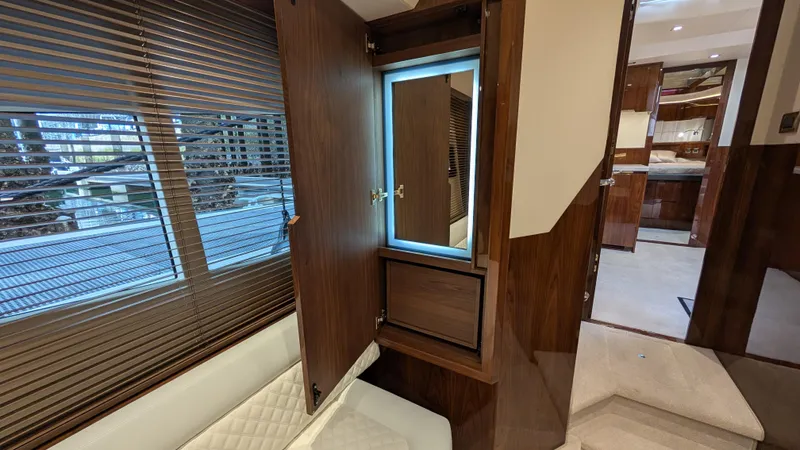 Lady C Yacht Photos Pics Luxurious interior of 2022 Galeon 485 HTS yacht with wood finishes and seating.
