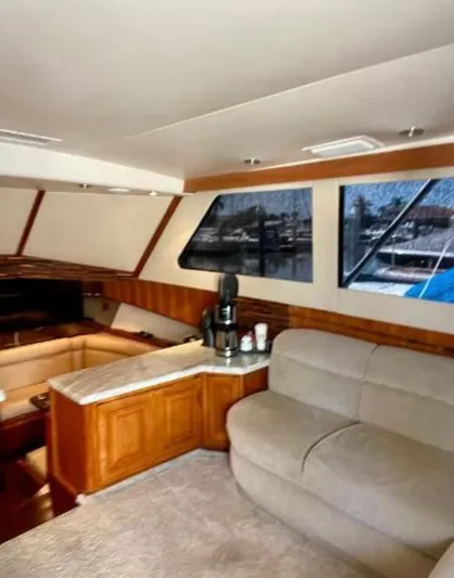  Yacht Photos Pics Interior of 1994 Viking 38 Convertible yacht with cozy seating and large windows.