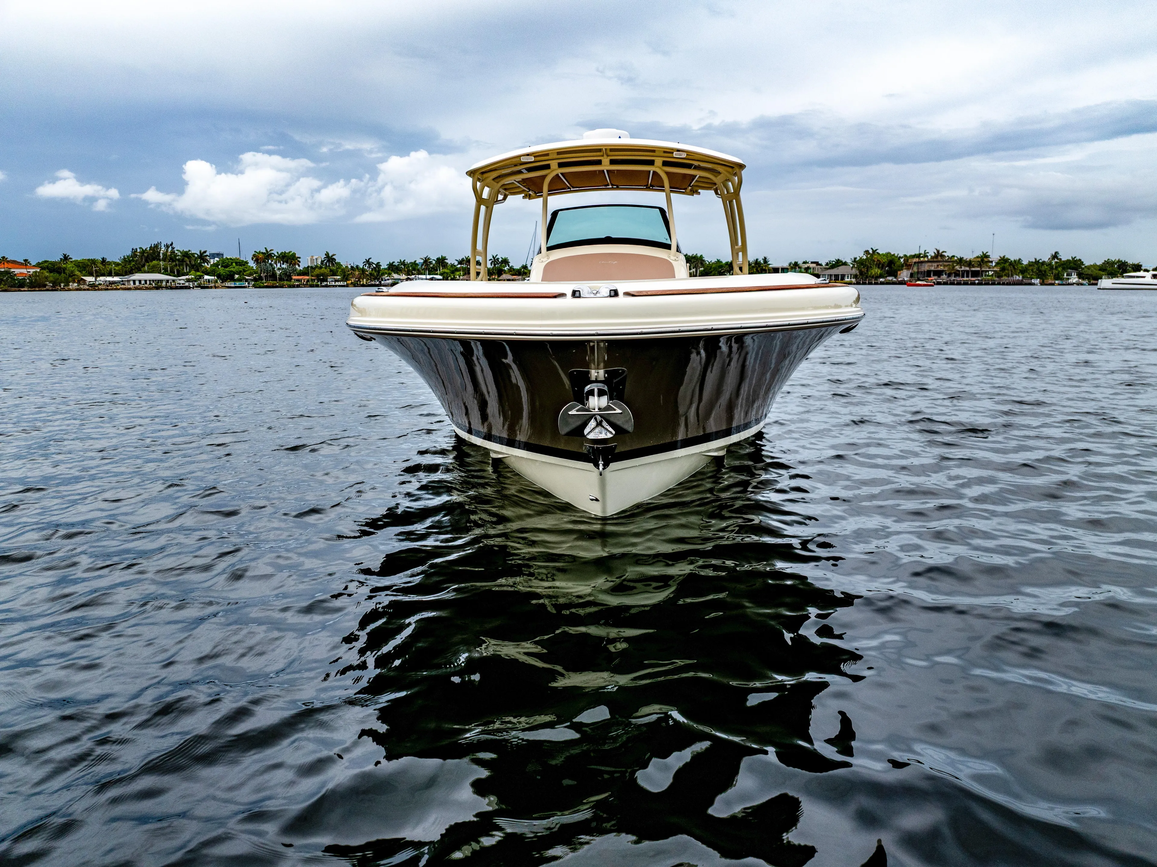 Lady Liberty Yacht Photos Pics 2018 Chris-Craft Catalina 34 boat on calm water under cloudy sky.