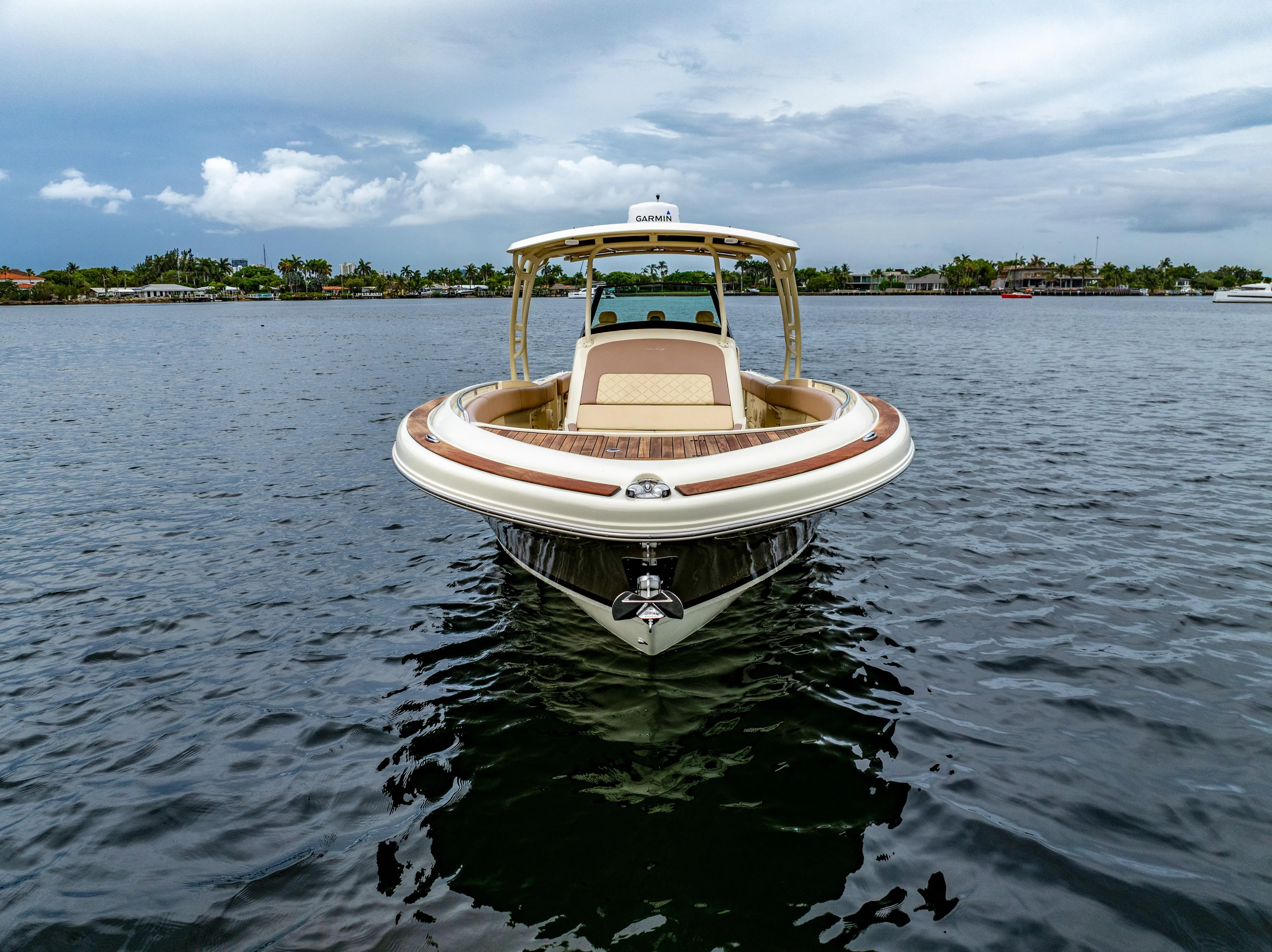Lady Liberty Yacht Photos Pics 2018 Chris-Craft Catalina 34 boat on calm water under cloudy sky.