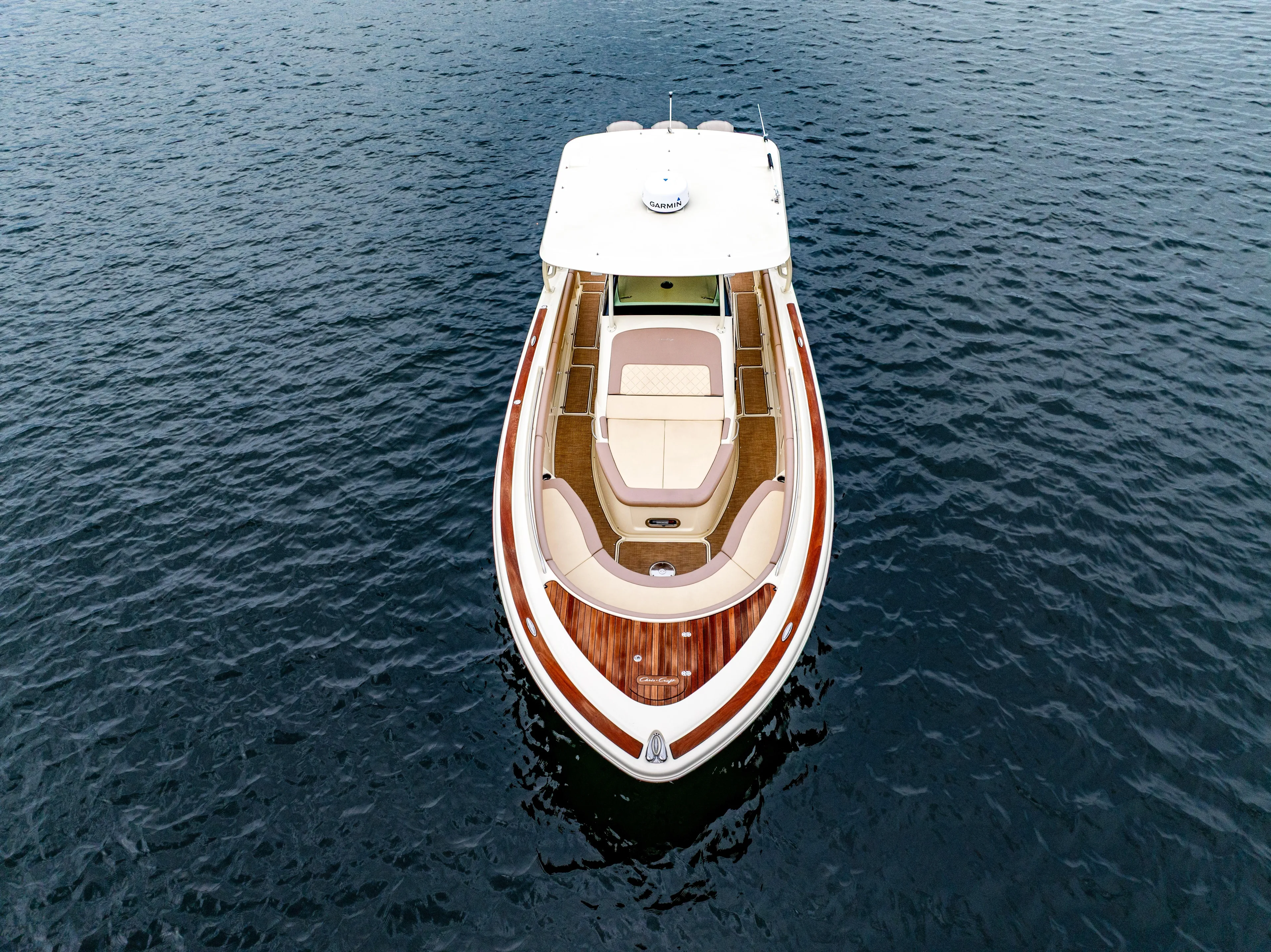 Lady Liberty Yacht Photos Pics 2018 Chris-Craft Catalina 34 boat on calm water, aerial view.