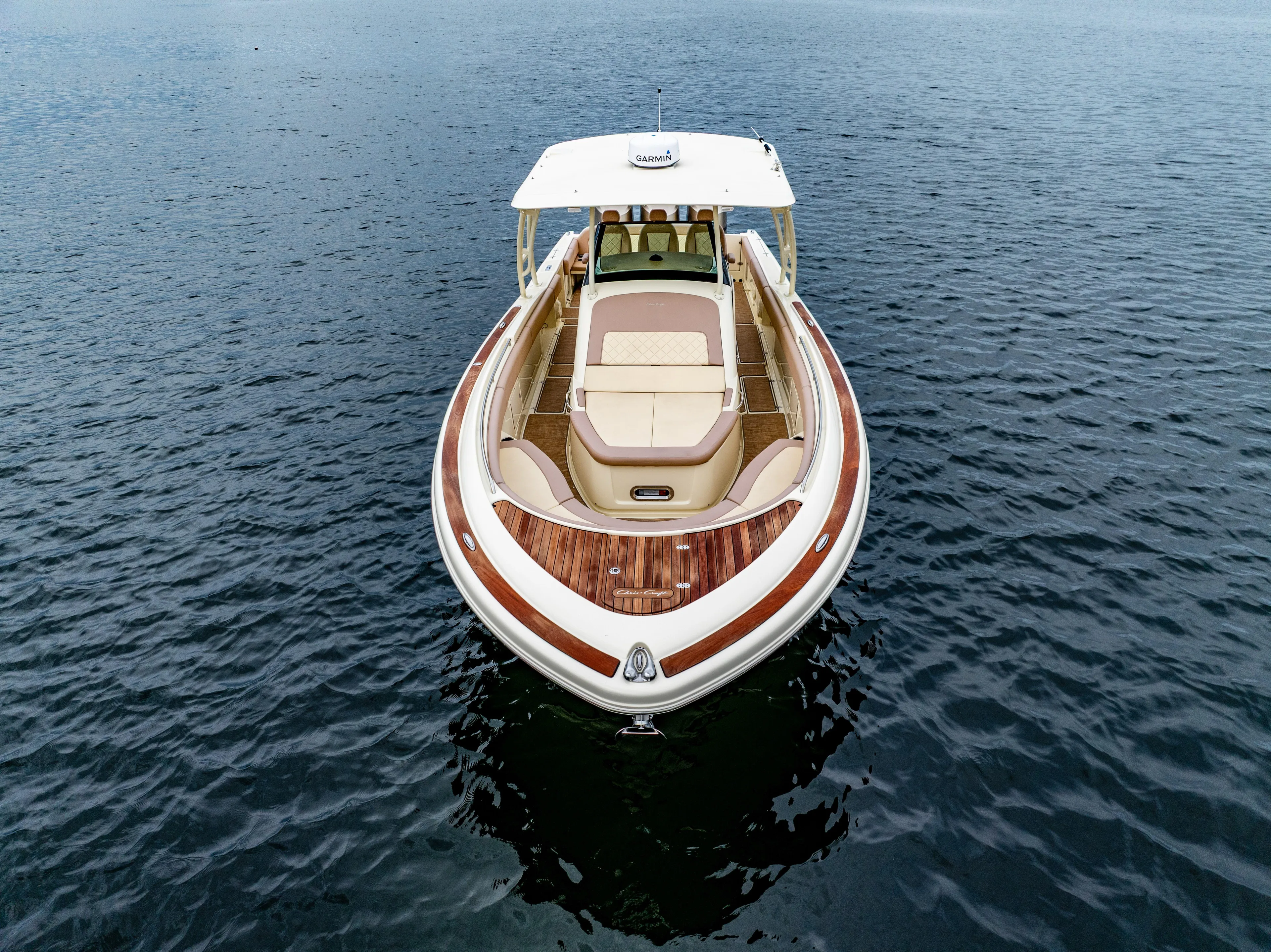 Lady Liberty Yacht Photos Pics 2018 Chris-Craft Catalina 34 boat on calm water, showcasing elegant design and spacious deck.