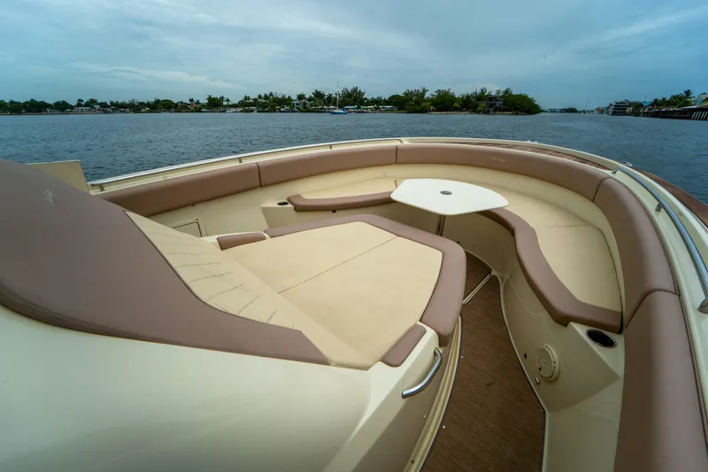 Lady Liberty Yacht Photos Pics 2018 Chris-Craft Catalina 34 boat interior with cushioned seating and table on calm water.