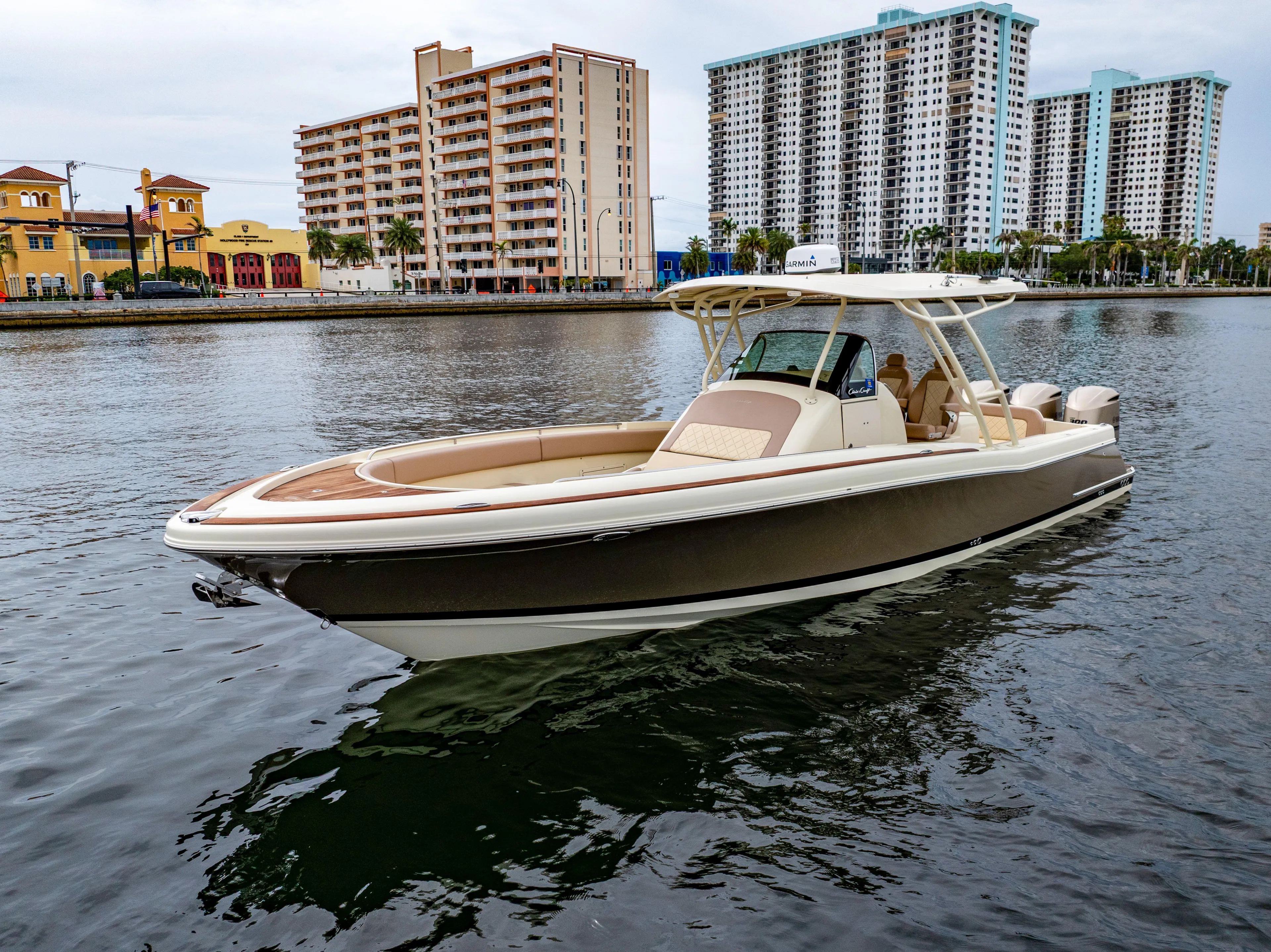 Lady Liberty Yacht Photos Pics 2018 Chris-Craft Catalina 34 boat on water, with cityscape background.