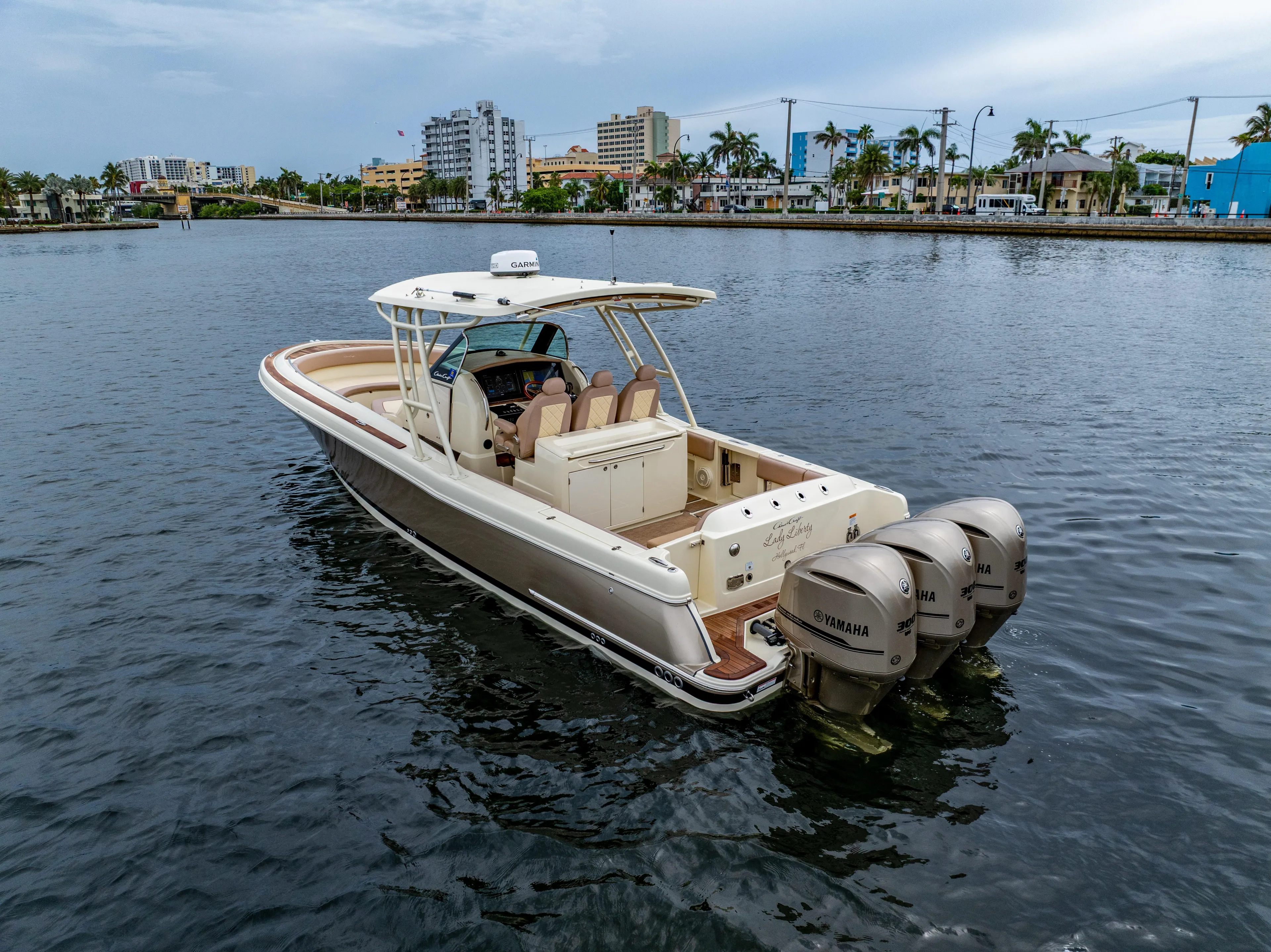 Lady Liberty Yacht Photos Pics 2018 Chris-Craft Catalina 34 boat with triple Yamaha engines on calm water.