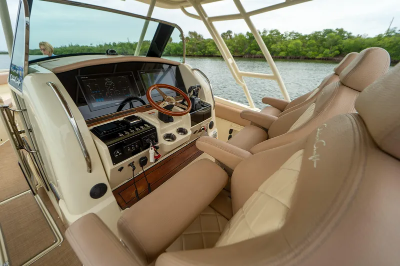 Lady Liberty Yacht Photos Pics 2018 Chris-Craft Catalina 34 helm with luxurious seating and advanced navigation controls.