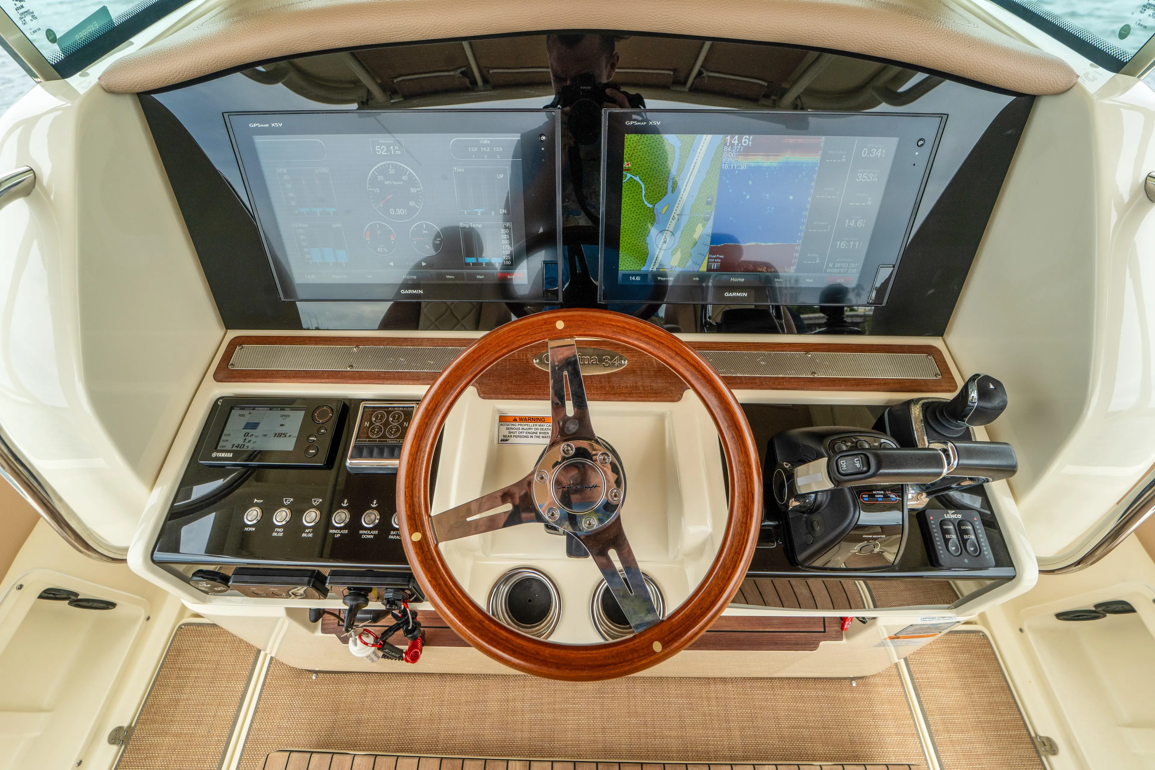 Lady Liberty Yacht Photos Pics 2018 Chris-Craft Catalina 34 helm with dual displays and wooden steering wheel.