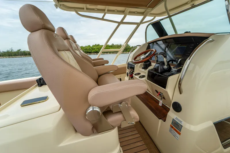 Lady Liberty Yacht Photos Pics 2018 Chris-Craft Catalina 34 helm with luxurious seating and advanced controls.