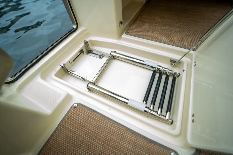 Lady Liberty Yacht Photos Pics 2018 Chris-Craft Catalina 34 swim ladder compartment, open hatch, near water.