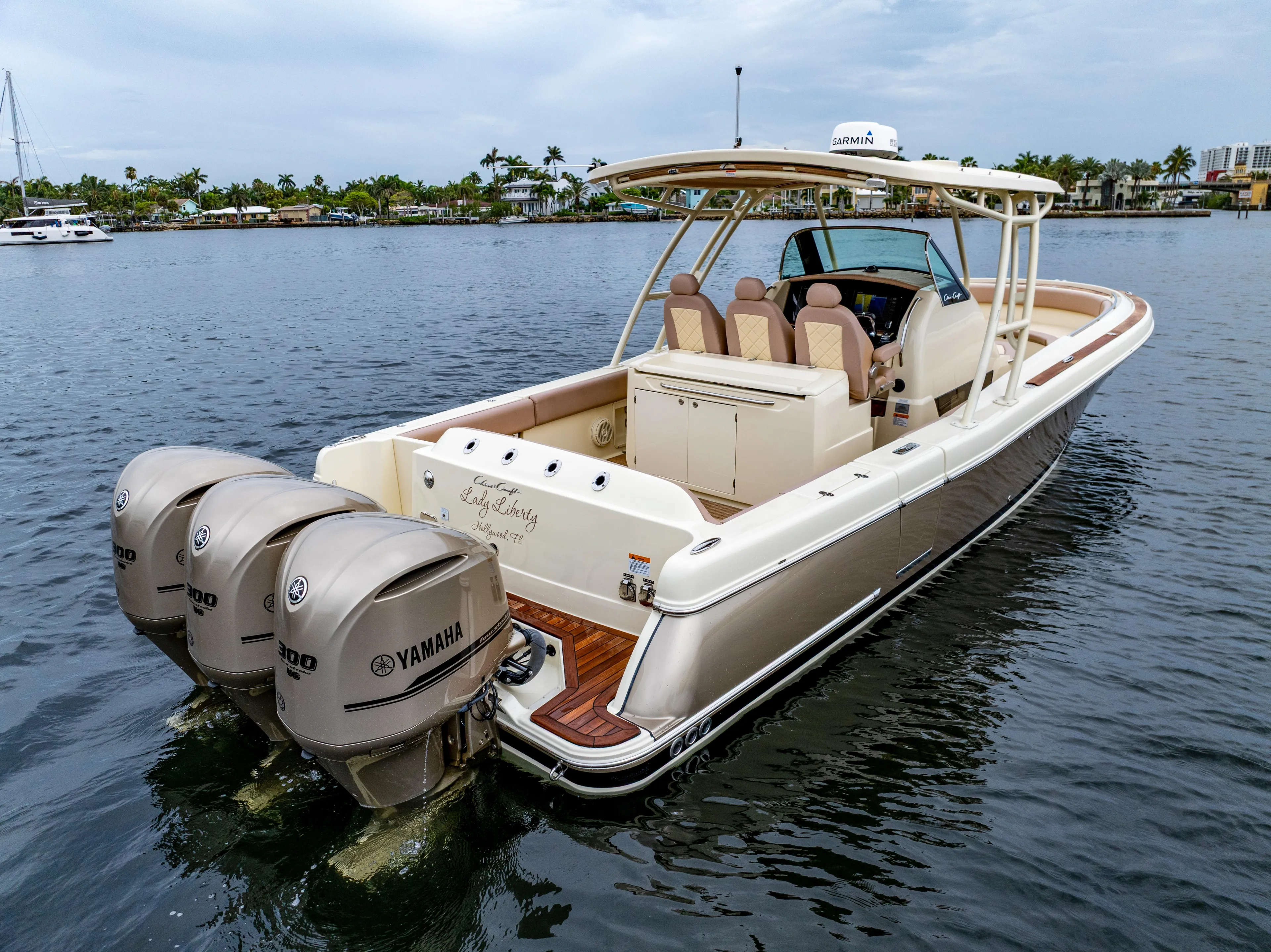 Lady Liberty Yacht Photos Pics 2018 Chris-Craft Catalina 34 boat with triple Yamaha engines on calm water.
