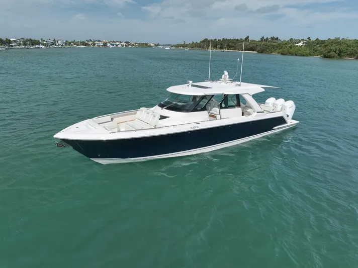 Sea Ya Yacht Photos Pics 2022 Tiara Sport 48LS luxury boat on calm turquoise water.