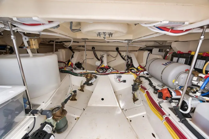 Sea Ya Yacht Photos Pics Engine room of 2022 Tiara Sport 48LS boat, showcasing wiring and equipment.