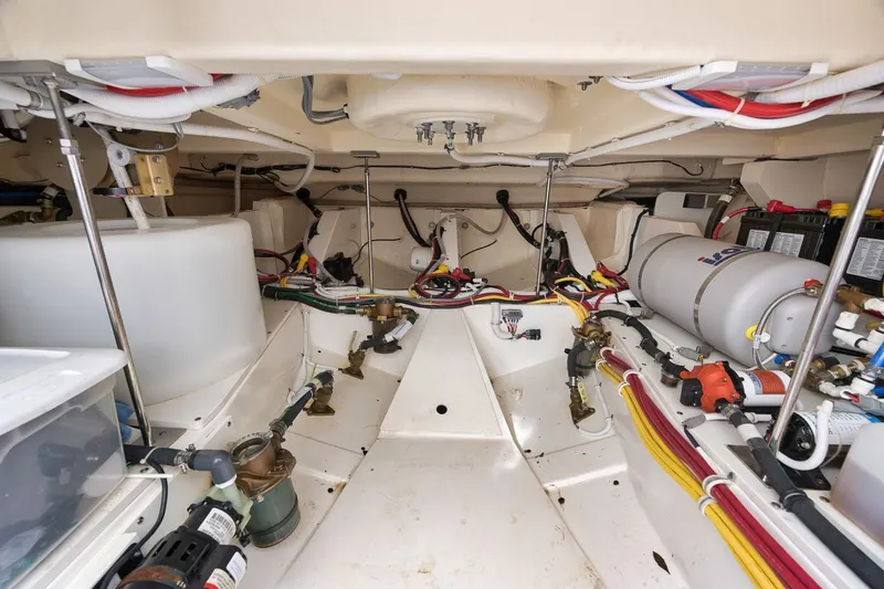 Sea Ya Yacht Photos Pics Engine room of 2022 Tiara Sport 48LS boat, showcasing wiring and equipment.