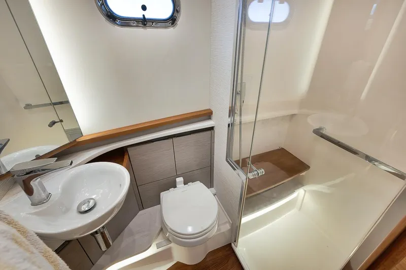 Sea Ya Yacht Photos Pics Luxurious 2022 Tiara Sport 48LS yacht bathroom with modern fixtures and shower.