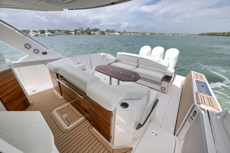 Sea Ya Yacht Photos Pics Luxurious 2022 Tiara Sport 48LS yacht deck with seating and ocean view.