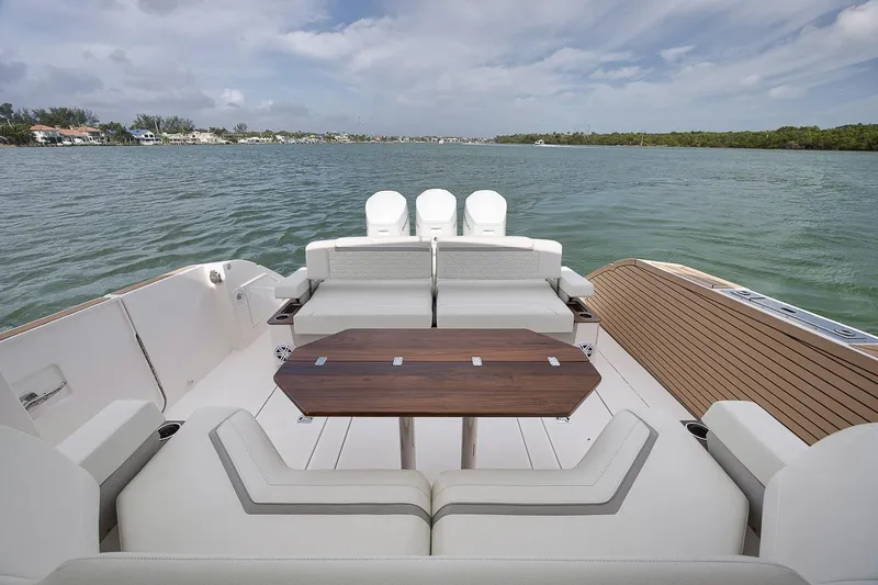 Sea Ya Yacht Photos Pics 2022 Tiara Sport 48LS luxury boat with spacious seating and scenic water view.
