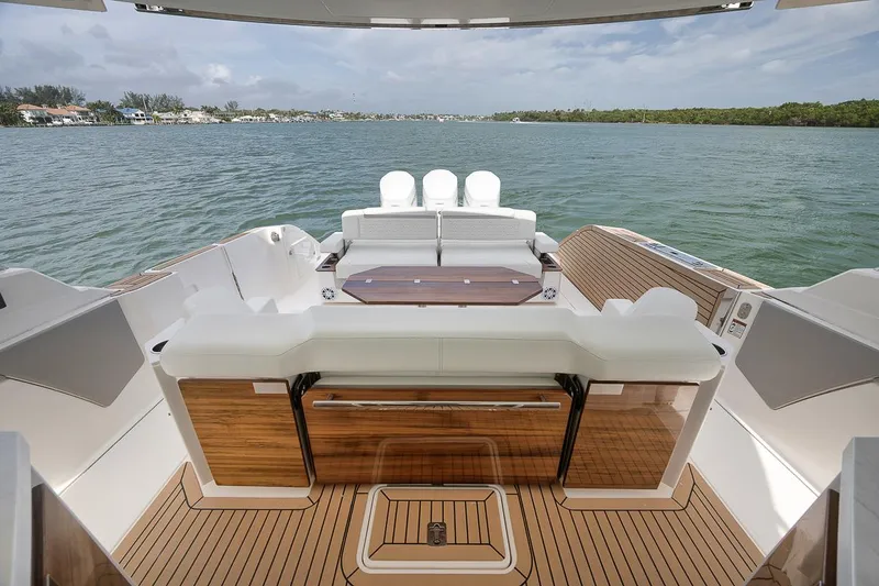 Sea Ya Yacht Photos Pics 2022 Tiara Sport 48LS luxury yacht interior with sleek wooden deck and seating.