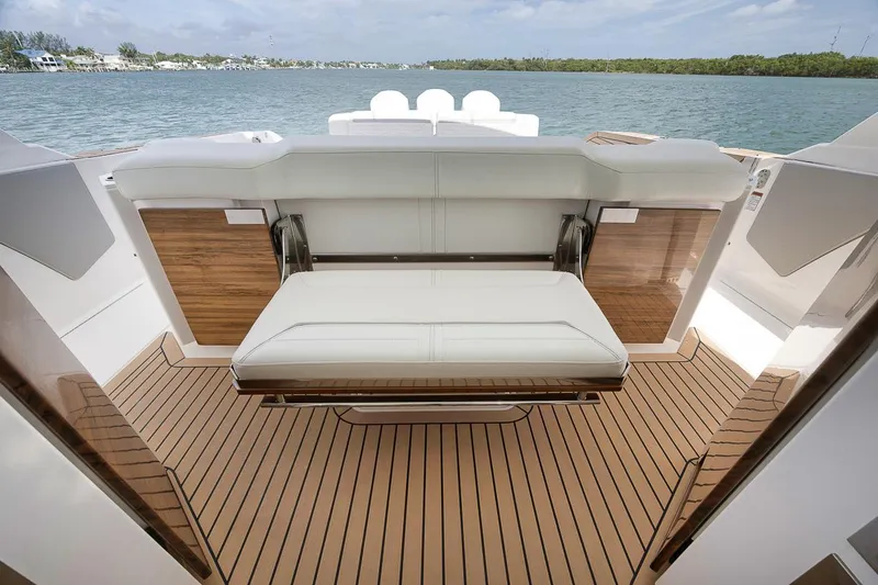 Sea Ya Yacht Photos Pics 2022 Tiara Sport 48LS yacht interior with elegant seating and teak flooring.