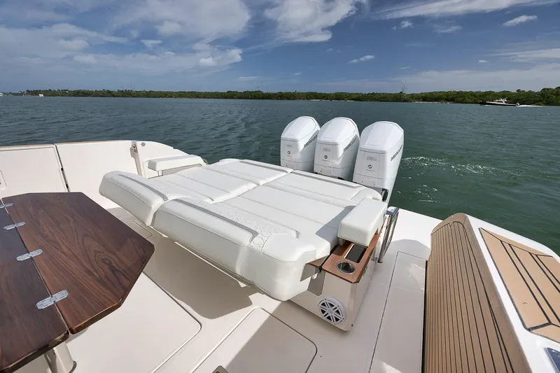 Sea Ya Yacht Photos Pics 2022 Tiara Sport 48LS luxury boat with triple engines on a serene lake.