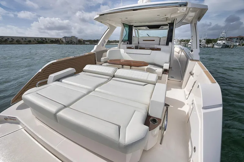 Sea Ya Yacht Photos Pics 2022 Tiara Sport 48LS luxury yacht with spacious deck and seating on calm water.