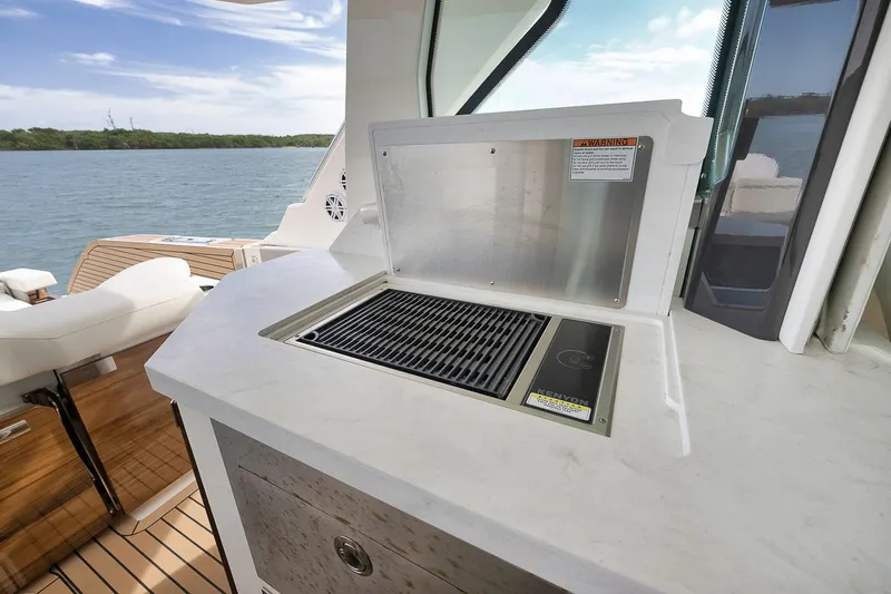 Sea Ya Yacht Photos Pics Outdoor grill on 2022 Tiara Sport 48LS yacht with scenic water view.