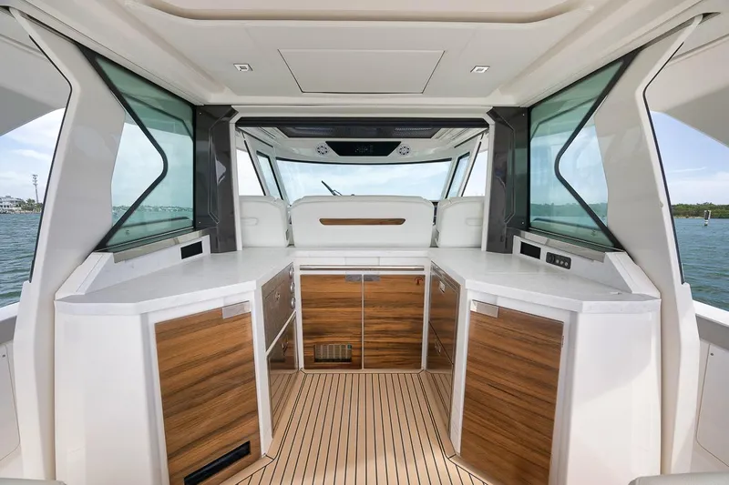 Sea Ya Yacht Photos Pics Luxurious interior of 2022 Tiara Sport 48LS yacht with sleek wood cabinetry.