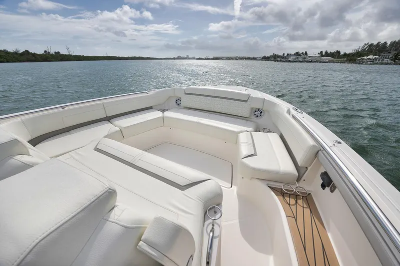 Sea Ya Yacht Photos Pics Luxurious 2022 Tiara Sport 48LS boat interior with spacious seating on calm waters.