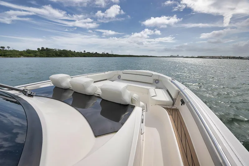 Sea Ya Yacht Photos Pics 2022 Tiara Sport 48LS luxury boat cruising on a sunny day.