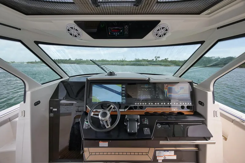 Sea Ya Yacht Photos Pics 2022 Tiara Sport 48LS boat cockpit with advanced navigation system and panoramic view.