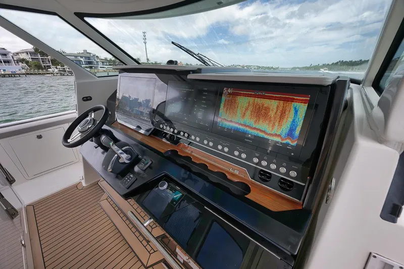Sea Ya Yacht Photos Pics 2022 Tiara Sport 48LS yacht helm with advanced navigation displays and controls.