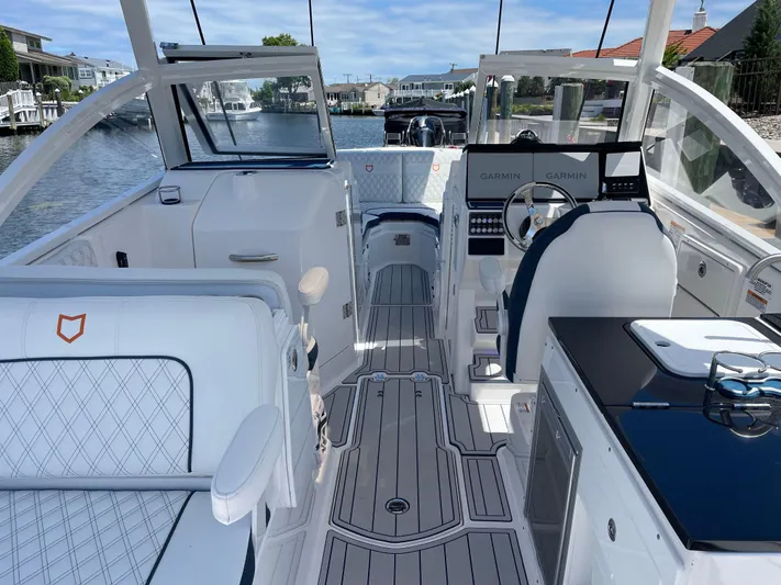  Yacht Photos Pics 2024 Sea Fox 288 Traveler boat interior with modern navigation equipment and seating.