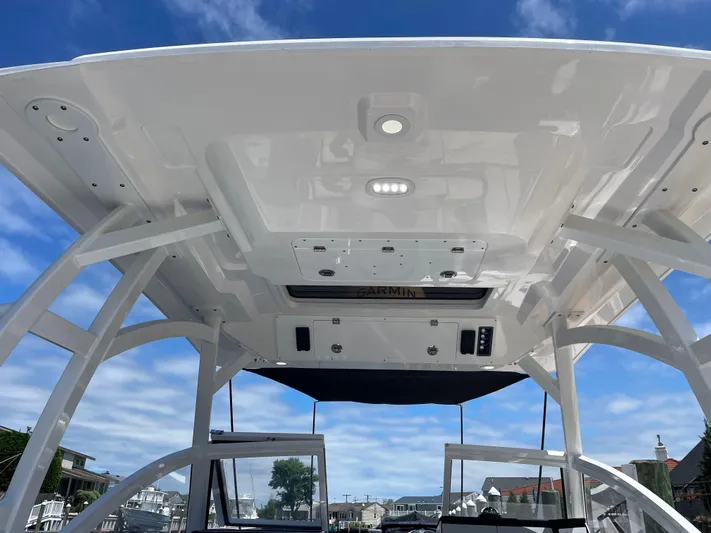  Yacht Photos Pics 2024 Sea Fox 288 Traveler boat interior with overhead electronics and clear sky.