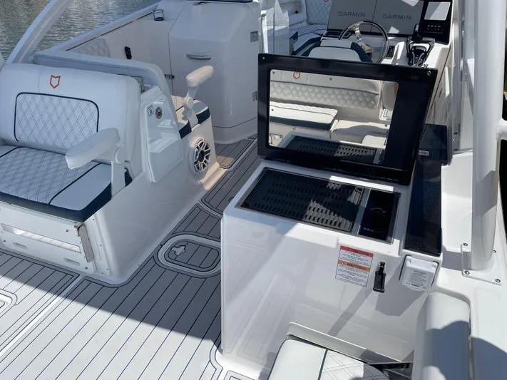  Yacht Photos Pics 2024 Sea Fox 288 Traveler boat interior with seating and control panel.