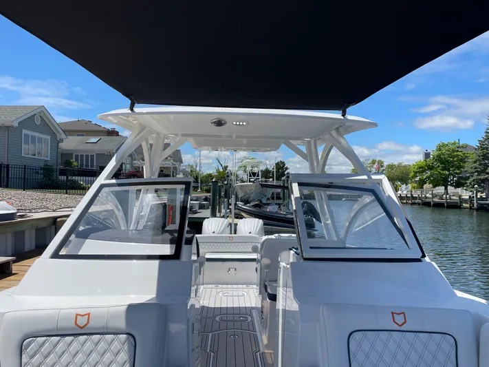  Yacht Photos Pics 2024 Sea Fox 288 Traveler boat interior with open deck and canopy.