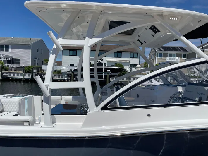  Yacht Photos Pics 2024 Sea Fox 288 Traveler boat docked in a residential marina.