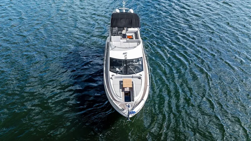 Almost Heaven Yacht Photos Pics 2021 Sunseeker Manhattan 52 yacht on open water, aerial view.