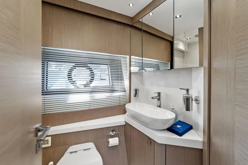 Almost Heaven Yacht Photos Pics Luxurious bathroom interior of 2021 Sunseeker Manhattan 52 yacht with modern fixtures.