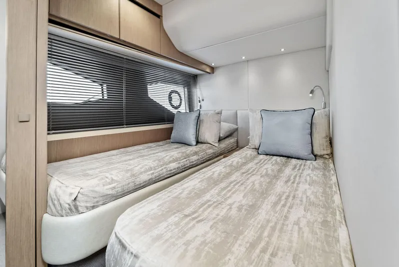 Almost Heaven Yacht Photos Pics Luxurious twin cabin in 2021 Sunseeker Manhattan 52 yacht, featuring modern design and comfort.