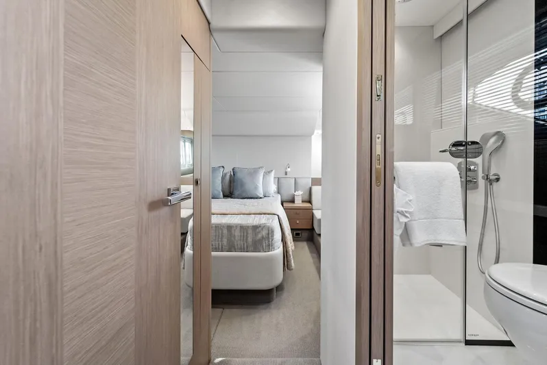 Almost Heaven Yacht Photos Pics Luxurious interior of 2021 Sunseeker Manhattan 52 yacht, featuring a modern bedroom and bathroom.