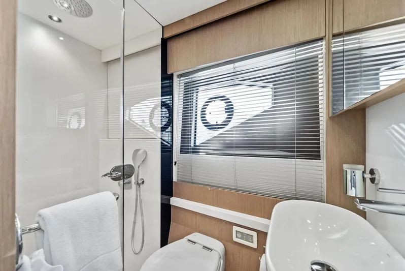 Almost Heaven Yacht Photos Pics Luxurious bathroom in 2021 Sunseeker Manhattan 52 yacht with modern fixtures and elegant design.