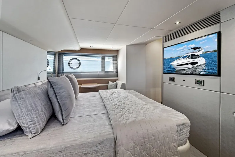 Almost Heaven Yacht Photos Pics Luxurious Sunseeker Manhattan 52 yacht bedroom interior, featuring modern design and a large TV, 2021 model.