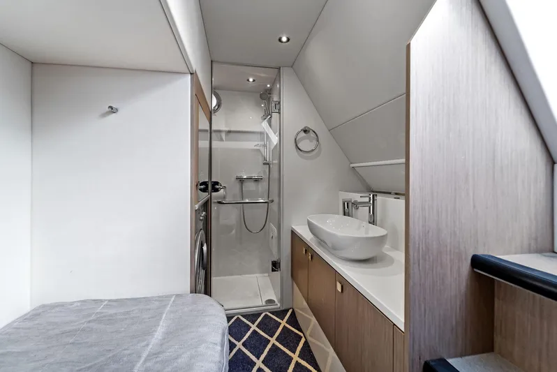 Almost Heaven Yacht Photos Pics Luxurious bathroom interior of 2021 Sunseeker Manhattan 52 yacht, featuring modern fixtures and elegant design.