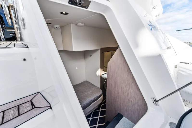 Almost Heaven Yacht Photos Pics 2021 Sunseeker Manhattan 52 yacht interior cabin with modern design and cozy sleeping area.